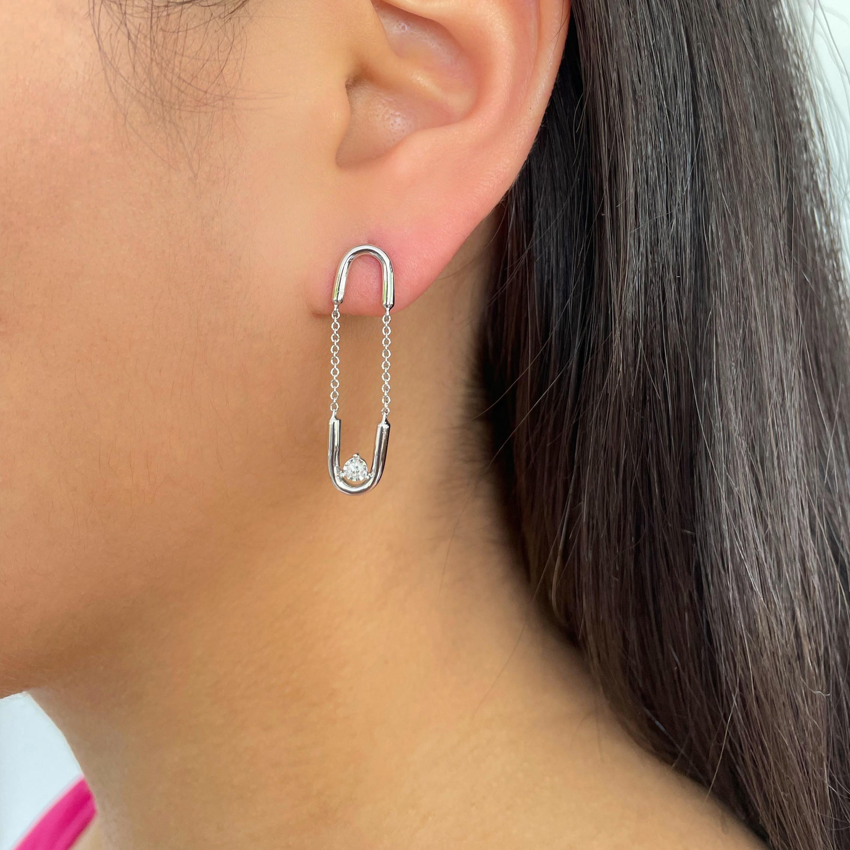 Arguably our most unique jewelry design in our collection, the Paperclip Dangling Diamond Earrings are a guarantee conversation starter. The name of these dangling diamond earrings comes from, not only the resemble to paperclips, but also their