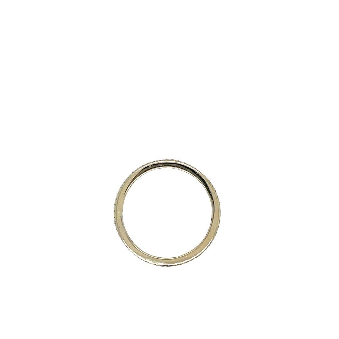 A single row of micropavé diamonds set on a narrow 14K white gold band. This elegant diamond eternity band offers a timeless, sophisticated look. 53 diamonds totaling 0..53 carats are arranged in an infinite row on this stunning ring.
The current