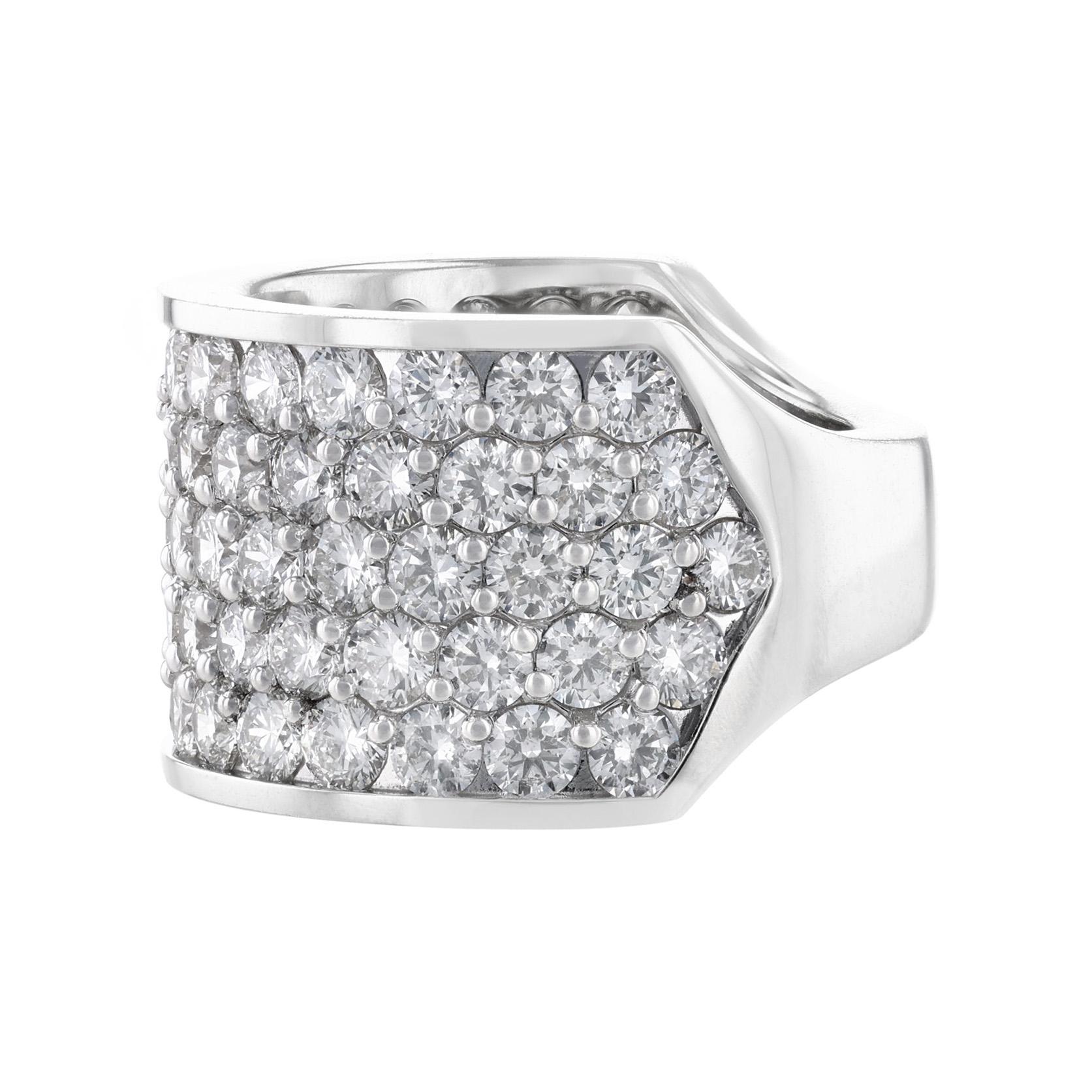 This men’s ring is 14K white gold and features 79 round cut diamonds. All diamonds are pave' set and weigh 9.44 carats combined. The ring has a color grade of (H) and a clarity grade of (I1) and (SI2).
