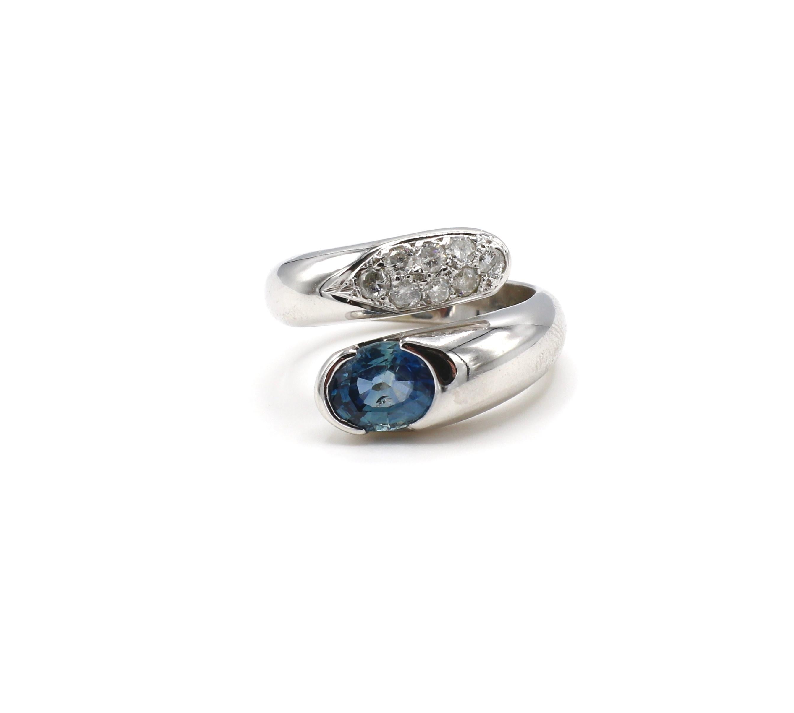 14K White Gold Diamond & Blue Sapphire Bypass Cocktail Ring 

Sapphire: Oval, approx. 1ct
Diamonds: 8 round diamonds, approx. 0.40ctw G SI
Ring is approx. 14mm at front and 4mm at base
Weight: 9.8 grams
Ring Size: 6.25 (US)
14KT White Gold
Stamps: