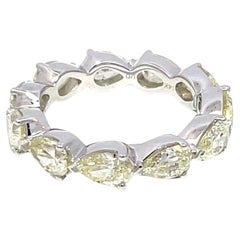 Fascia infinita con diamante a pera in oro bianco 14K