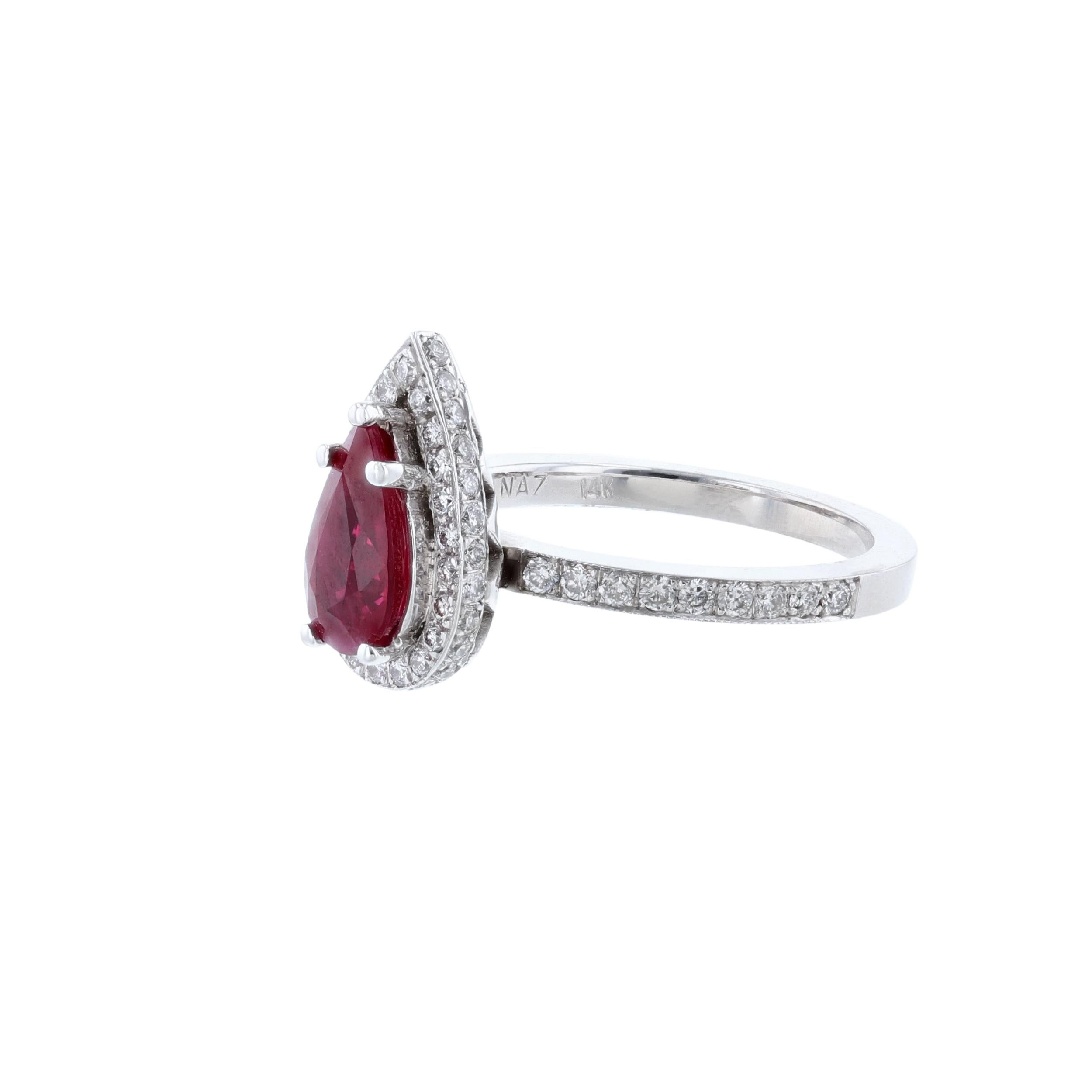 This ring is made in 14K white gold ring. It features 1 pear shape ruby weighing 1.46 carats. Also includes 68 round cut diamonds weighing 0.55 carats. With a color grade (H) and clarity grade (SI2)