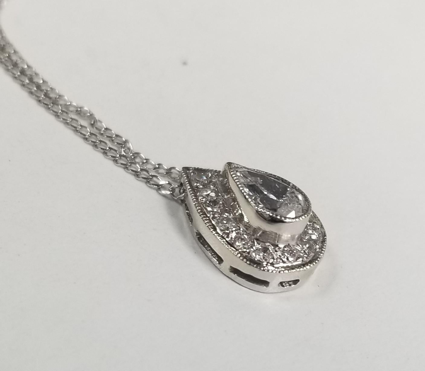 Specifications:
    PENDANT LENGTH: 1/2 inches
    CHAIN length:16 inch
    CHAIN & PENDANT weight: 2.6 gram
    STONES:  1 PEAR SHAPE   DIAMOND .35PTS.
    STONES: 14 ROUND DIAMONDS .21PTS.
    COLOR & CLARITY:   F-G, VS2-SI2
    metal:14k WHITE