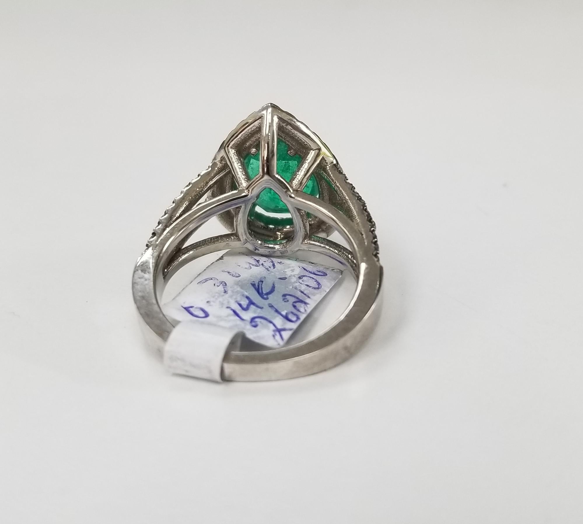 Contemporary 14 Karat White Gold Pear Shape Emerald and Diamond Double Halo Ring