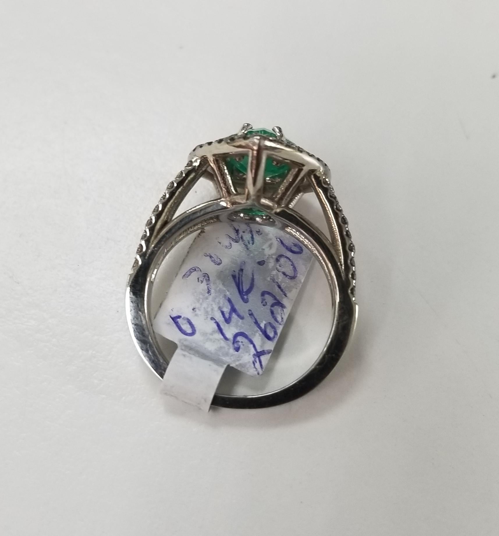 Pear Cut 14 Karat White Gold Pear Shape Emerald and Diamond Double Halo Ring