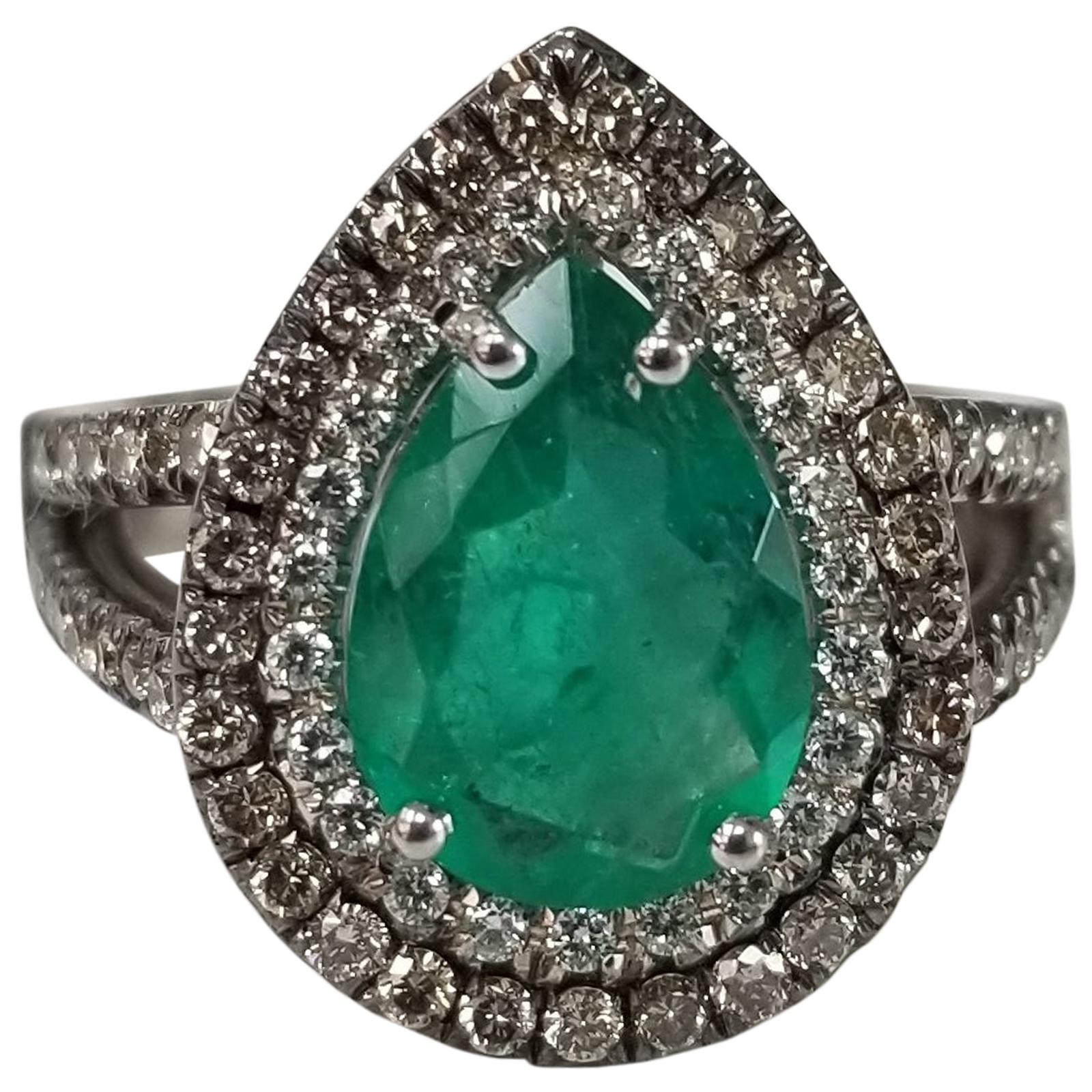 14 Karat White Gold Pear Shape Emerald and Diamond Double Halo Ring