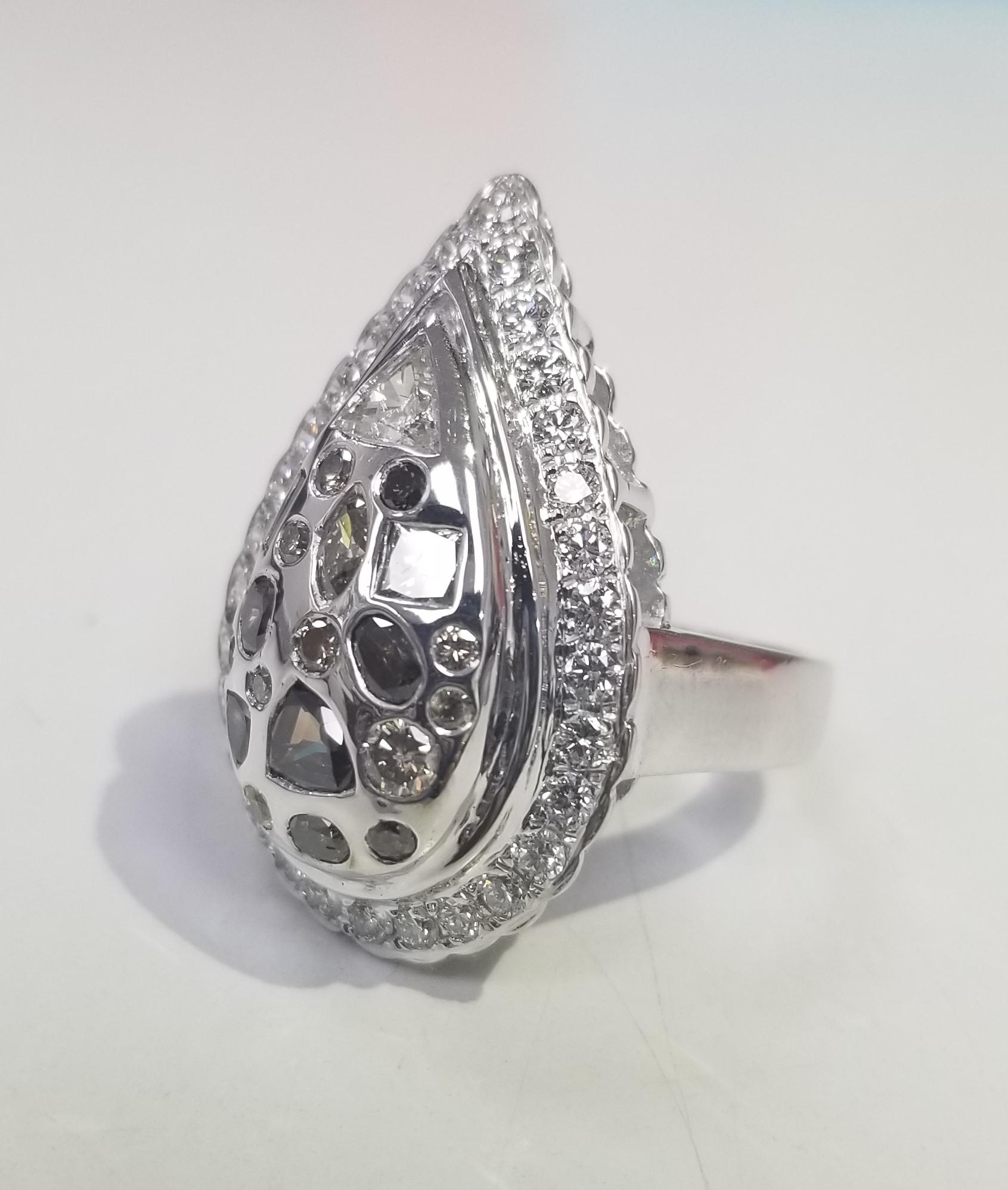 14k white gold pear shape setting with 30 round full cut diamonds of very fine quality weighing .90pts. set with 10 natural diamonds; white, yellow and brown weighing 1.28cts. ring size is 7 