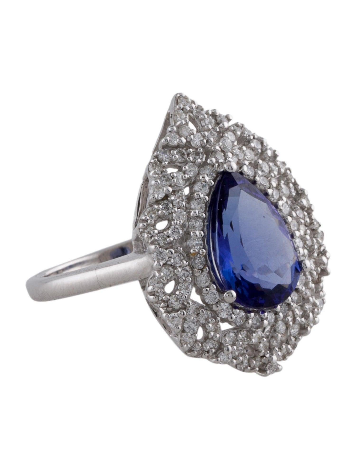 Step into a world of elegance with our 14K White Gold Tanzanite and Diamond Cocktail Ring, a symbol of luxury and sophistication. This exquisite piece is centered around a breathtaking 2.48 carat pear-shaped Tanzanite, known for its deep blue hue
