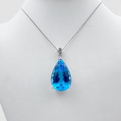 14k White Gold Pendant with 57 Ct. Blue Topaz and 18" Necklace.