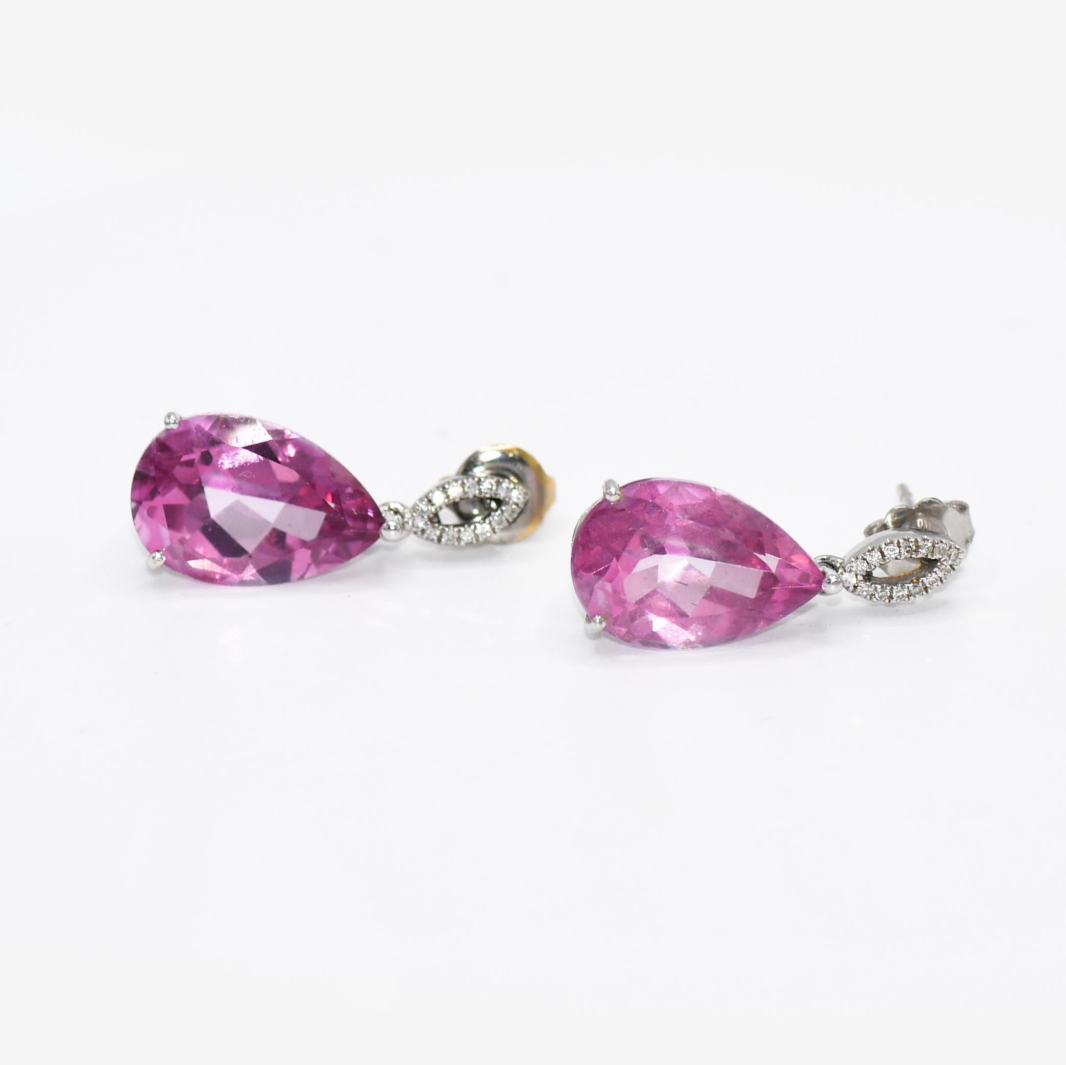 14K White Gold Pink Lab Topaz & Diamond Earrings, 15.00tcw, 6.8g
Pink topaz and diamond dangle earrings with 14k white gold settings.
Stamped 14k and weigh 6.8 grams gross weight, net 3.8 grams of 14k gold.
The topaz is lab treated to create a pink