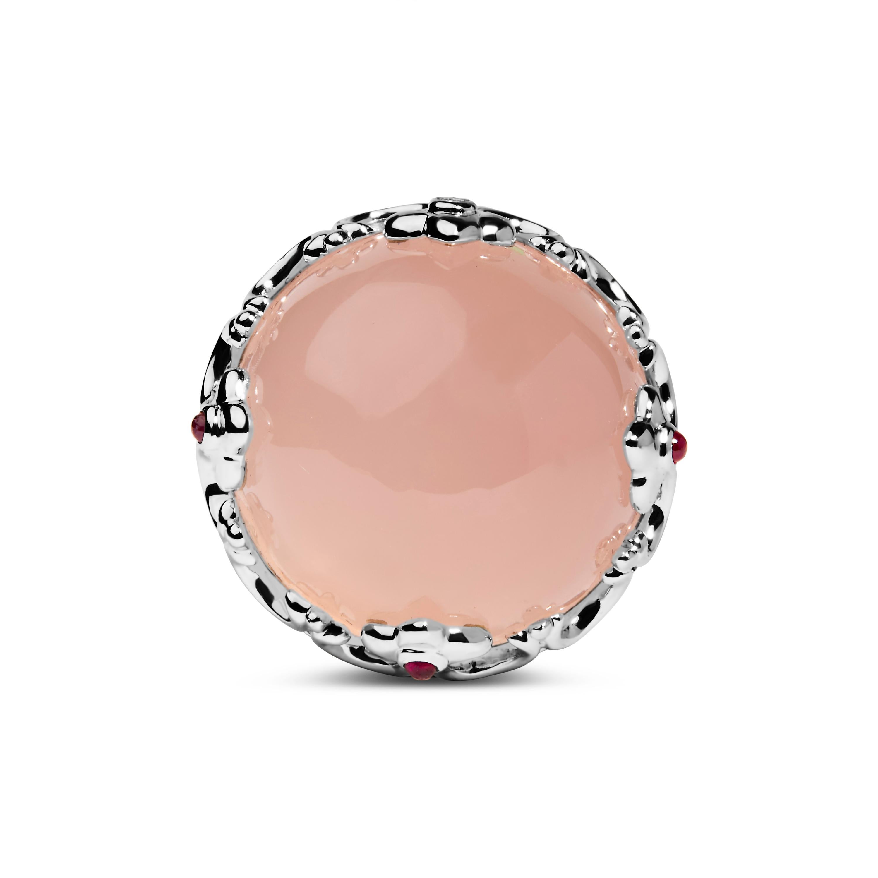 This exquisite 14K white gold cocktail ring elegantly showcases a stunning natural pink quartz crystal ball, its soft hue a whisper of romance and grace. Encircling this enchanting gemstone is a meticulously crafted crown-shaped setting, adorned