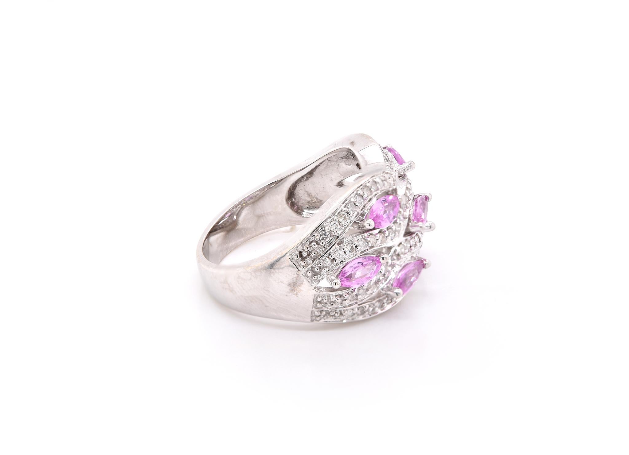 Material: 14k white gold
Gemstones: 7 pink marquise cut sapphires
Diamonds: 83 round brilliant cuts = 0.40cttw
Color: H
Clarity: SI2-I2
Ring Size: 7 ¼ (allow up to two additional business days for sizing requests)
Dimensions: ring measures 13.65mm