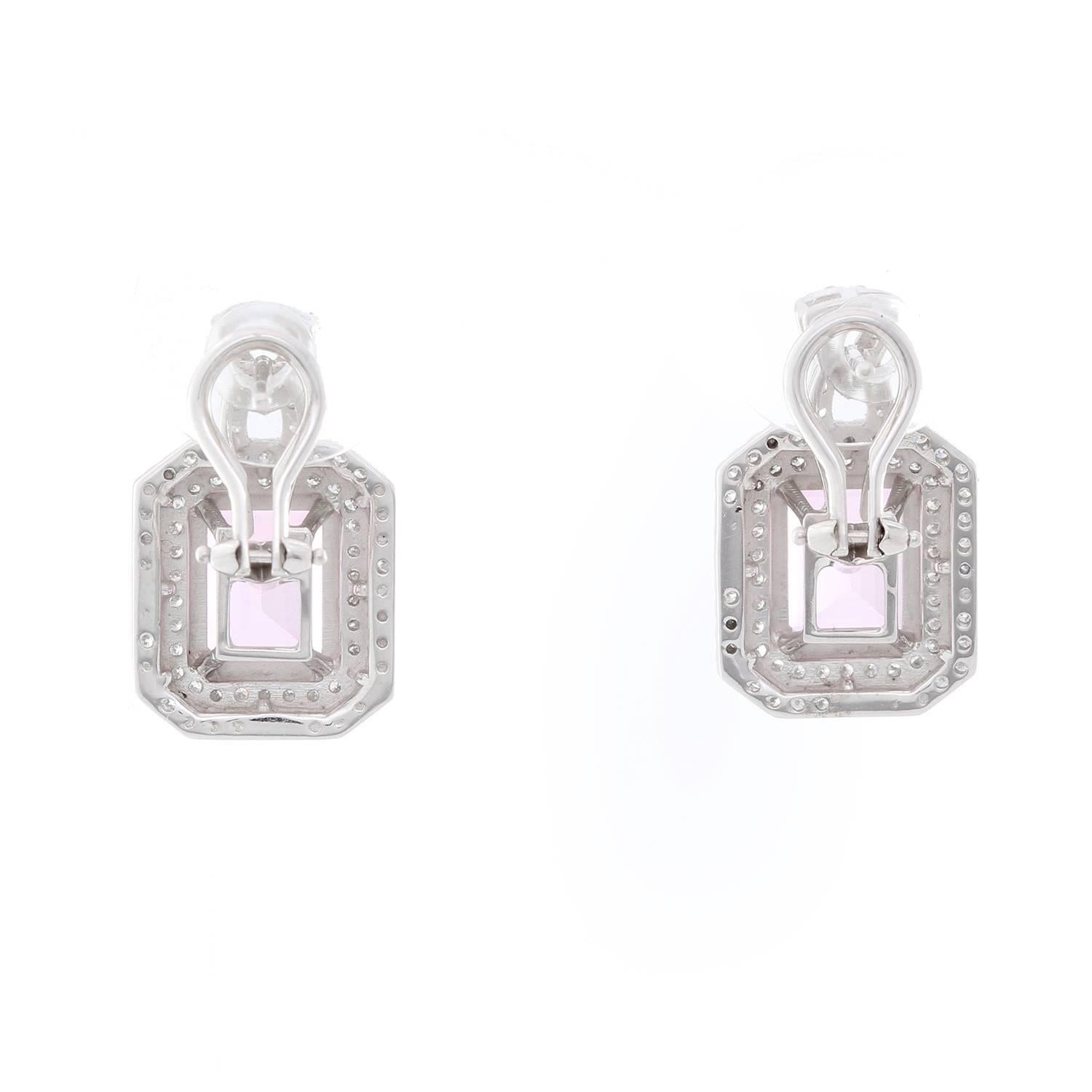 14K White Gold Pink Topaz  Diamond Earrings - . 14K White Gold earrings featuring an Emerald cut Pink Topaz, weighing 5 cts. Surrounded by diamonds weighing 1.10 cts.  Total measure 1  x 1 1/2 inches. Total weight 9.7 grams.