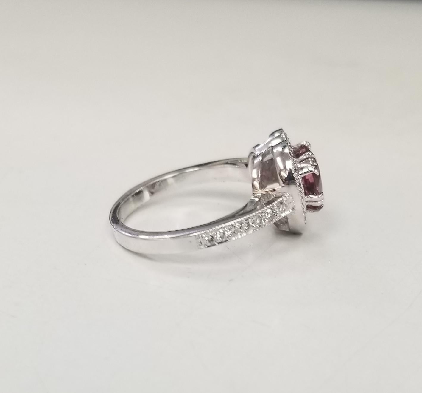Contemporary 14k white gold pink tourmaline and diamond halo ring