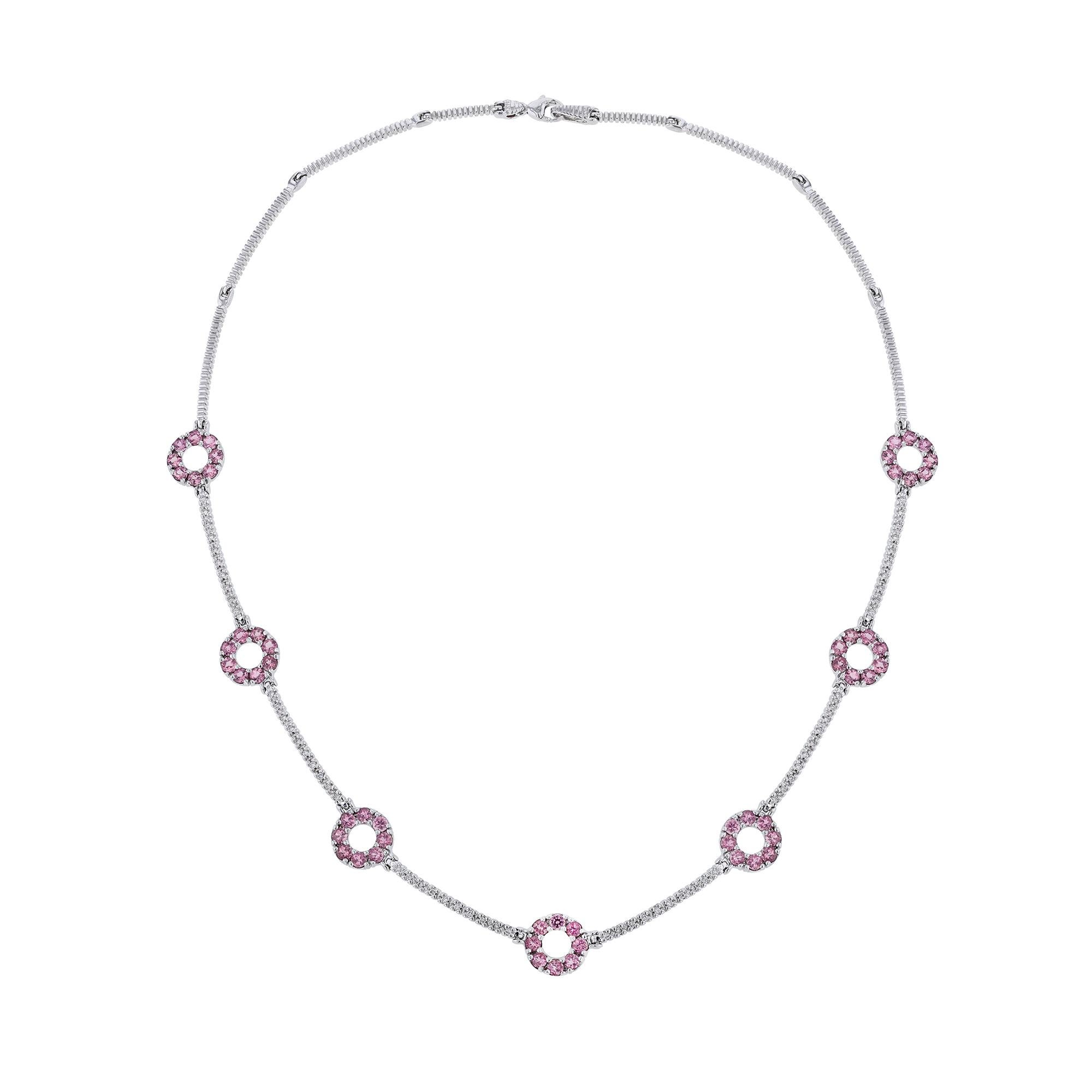 This necklace is made in 14K white gold and features 50 round cut diamonds weighing 0.30 carats. With seven round links of 56 pink tourmalines weighing 4.48 carats. All stones are prong set
