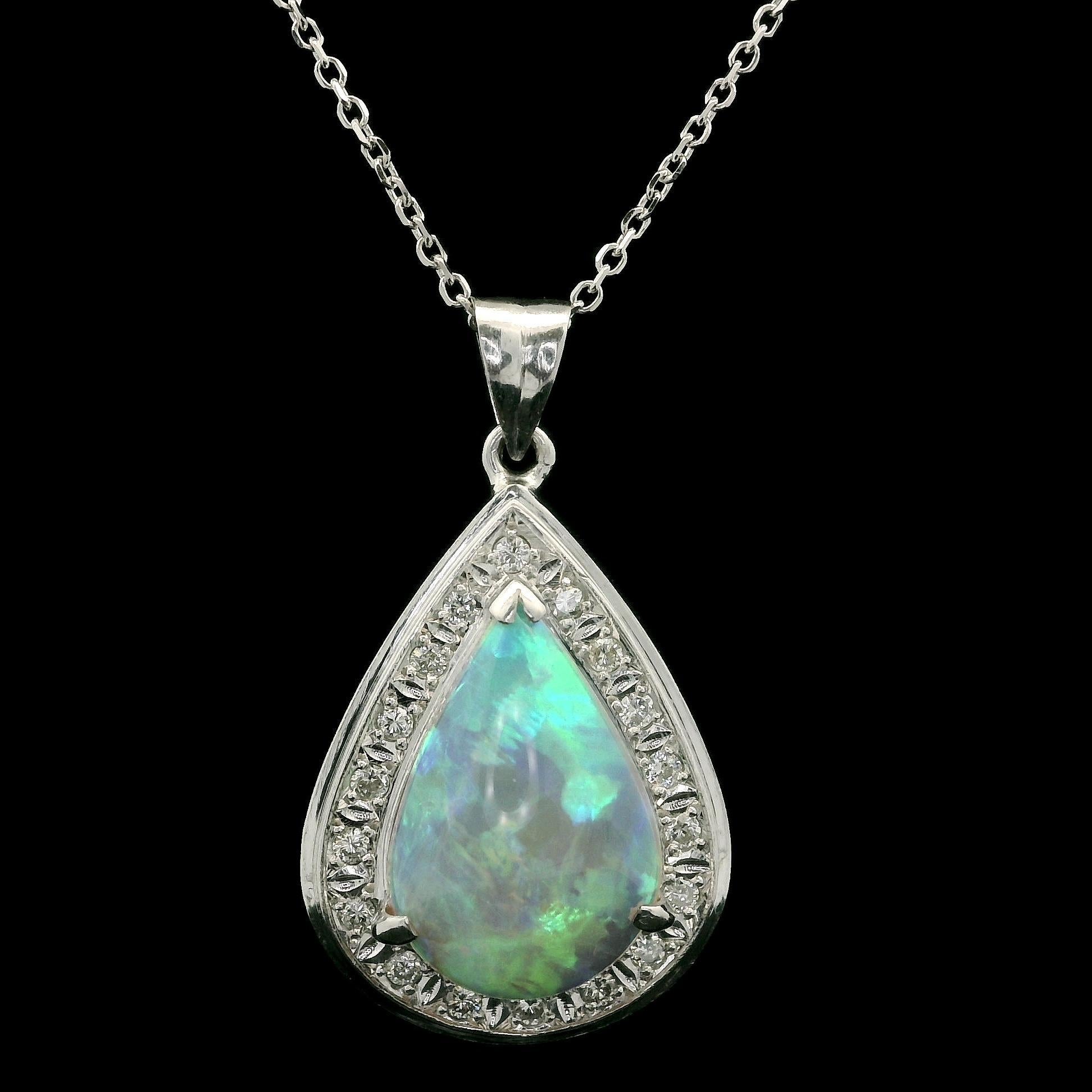 –Stone(s)–
(1) Natural Genuine Opal - Pear Cabochon Cut- Prong Set - White Base w/ Very Nice Color Play - 15.2x10.5mm (approx.) - 3.56ct (exact)
Numerous Natural Genuine Diamonds - Round Brilliant Cut - Pave Set - Nice Brilliant White Diamonds -