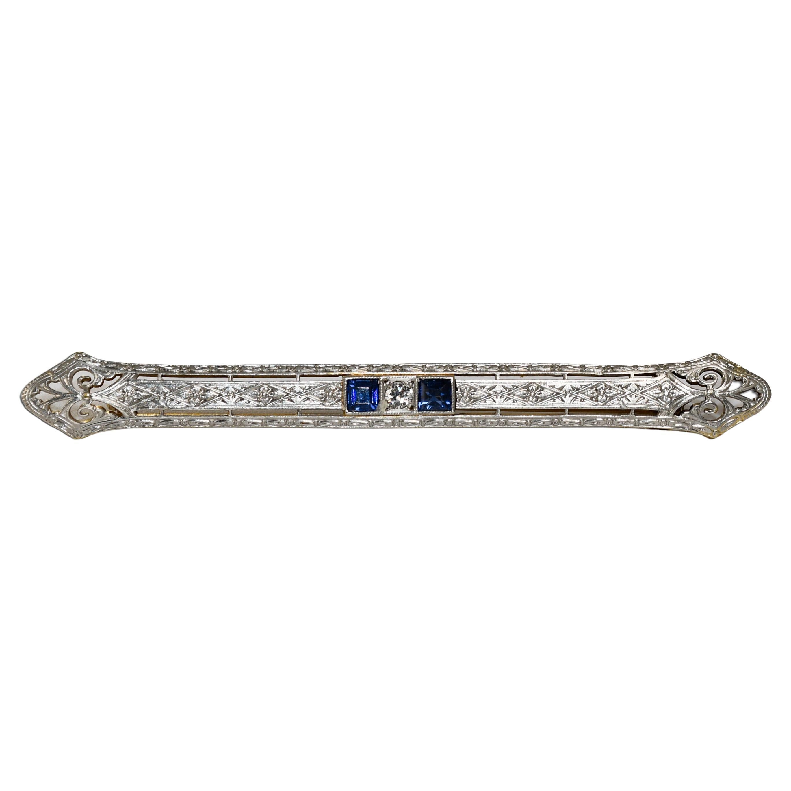 Spilla antica in oro bianco 14K e platino con diamante e spinello blu