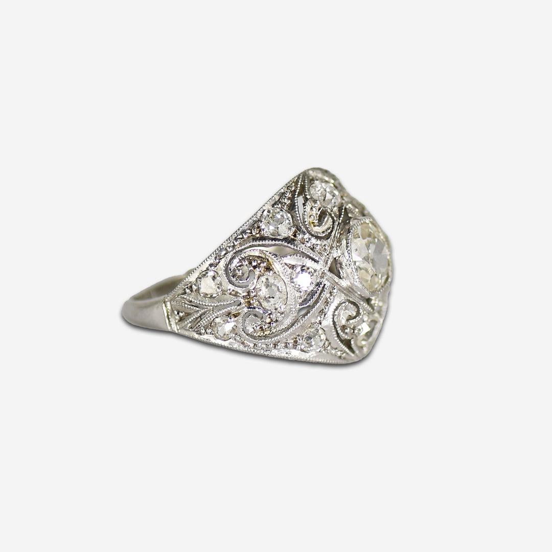Ladies antique, art deco diamond ring in platinum & 14k white gold setting.
The top half of the ring tests platinum.
The bottom half of the ring was changed to 14k white gold for ring sizing.
All diamonds are old mine cuts.
The center diamond is