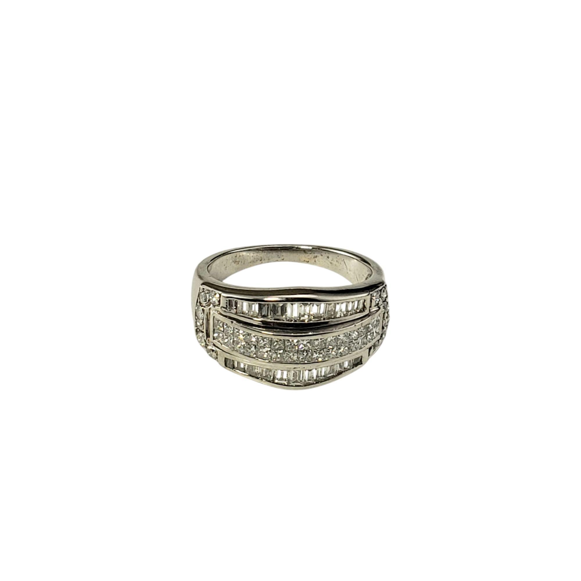 14K White Gold and Diamond Ring Size 5.75 JAGi Certified-

This sparkling ring features 30 princess cut diamonds, 24 baguette cut diamonds and 12 round brilliant cut diamonds set in classic 14K white gold.

Width: 11 mm. Shank: 2 mm.

Approximate