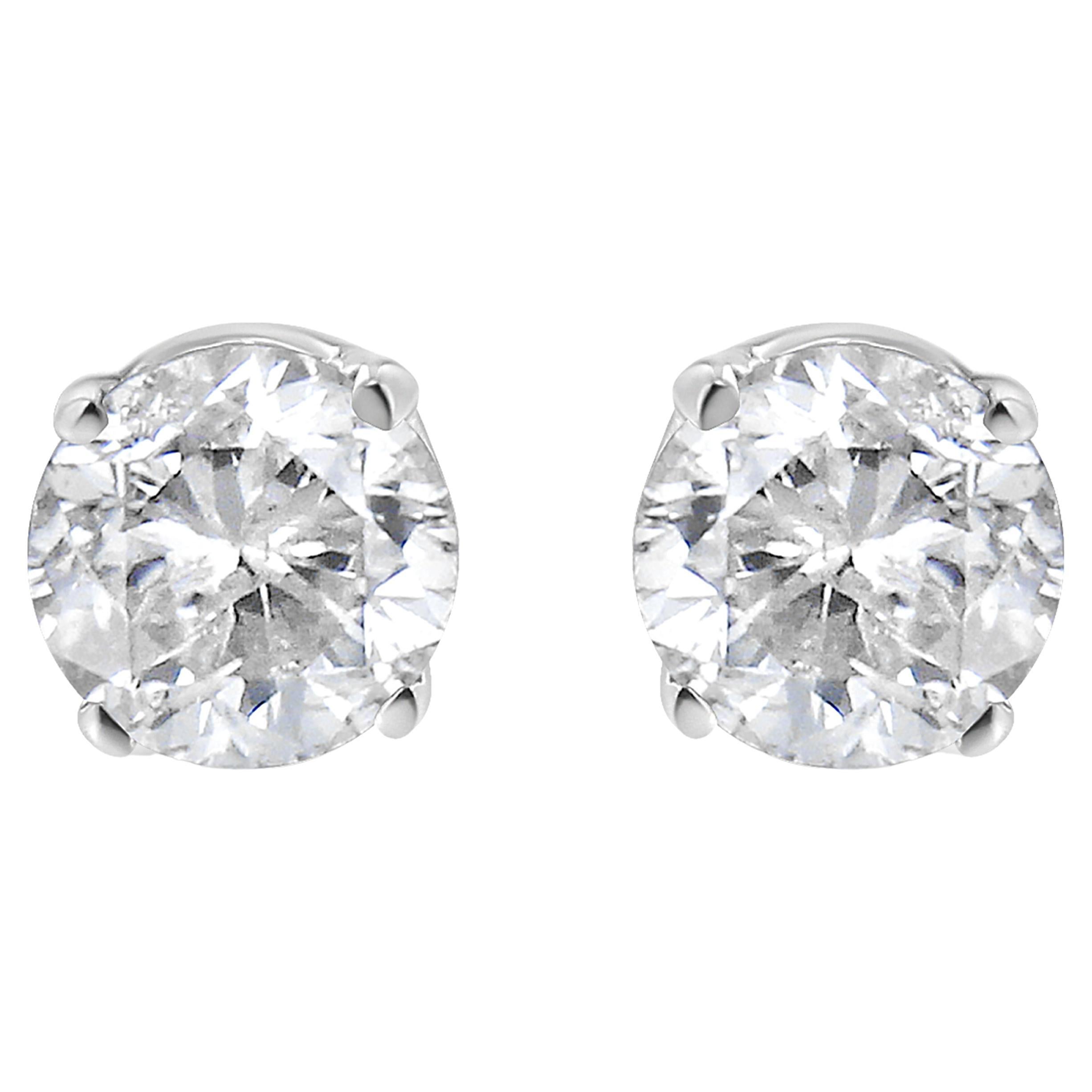 Clous d'oreilles solitaires en or blanc 14 carats avec diamants taille ronde de 1/2 carat