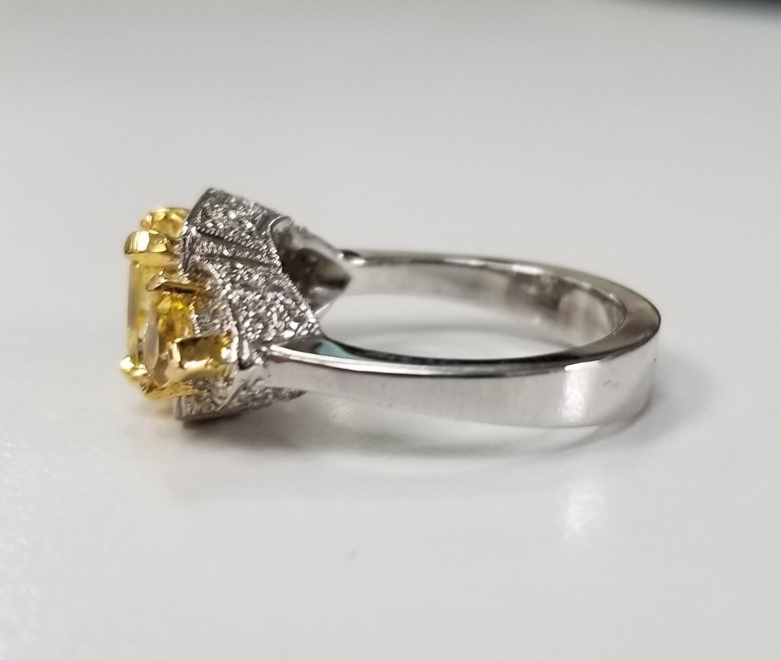 Artisan 14 Karat White Gold Radiant Cut Yellow Sapphire Halo and Diamond Ring For Sale