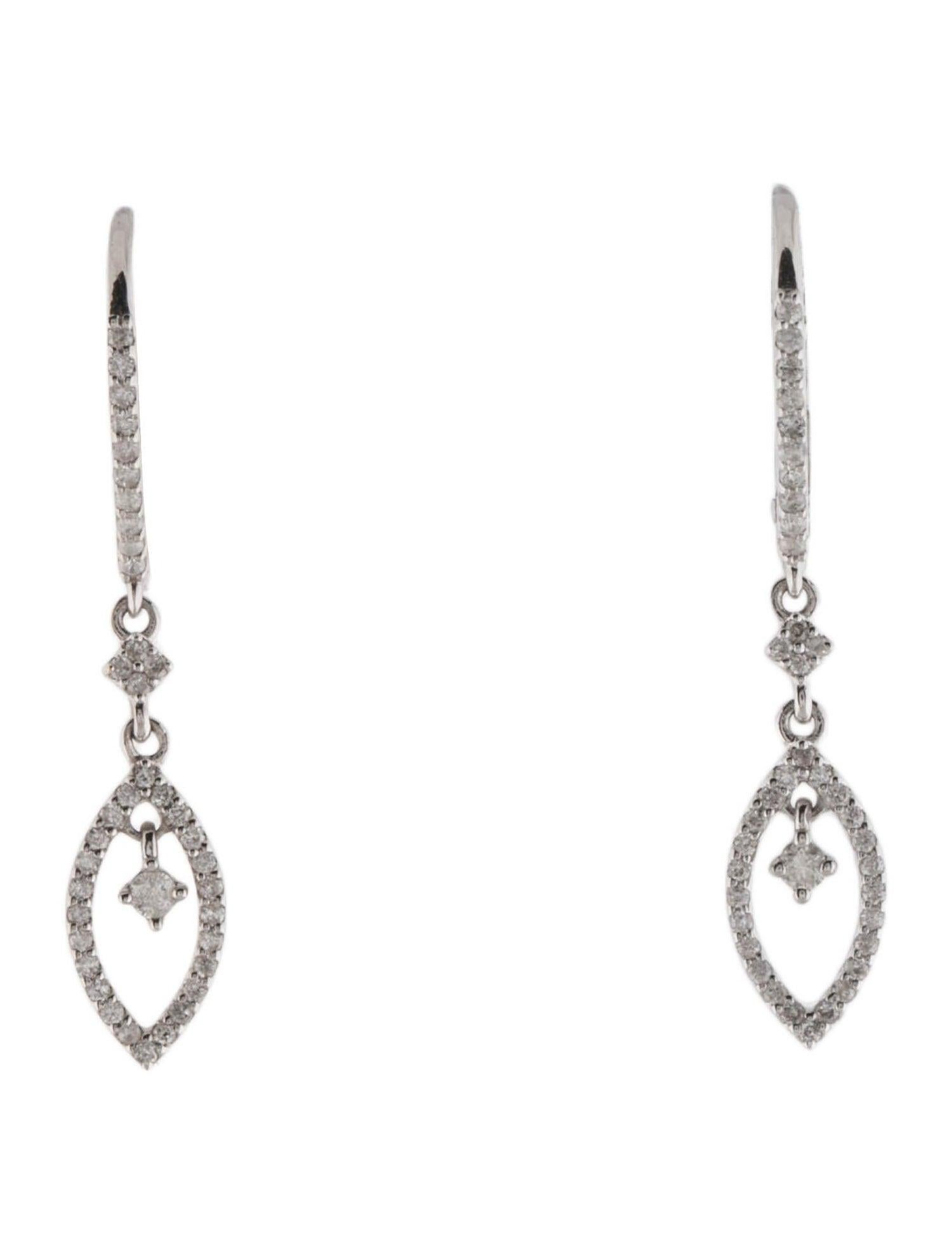Introducing our exquisite 14K White Gold Rhodium-Plated Diamond Drop Earrings, a captivating addition to any fine jewelry collection. These earrings feature 78 round brilliant cut diamonds, totaling 0.29 carats, set in beautifully rhodium-plated 14K