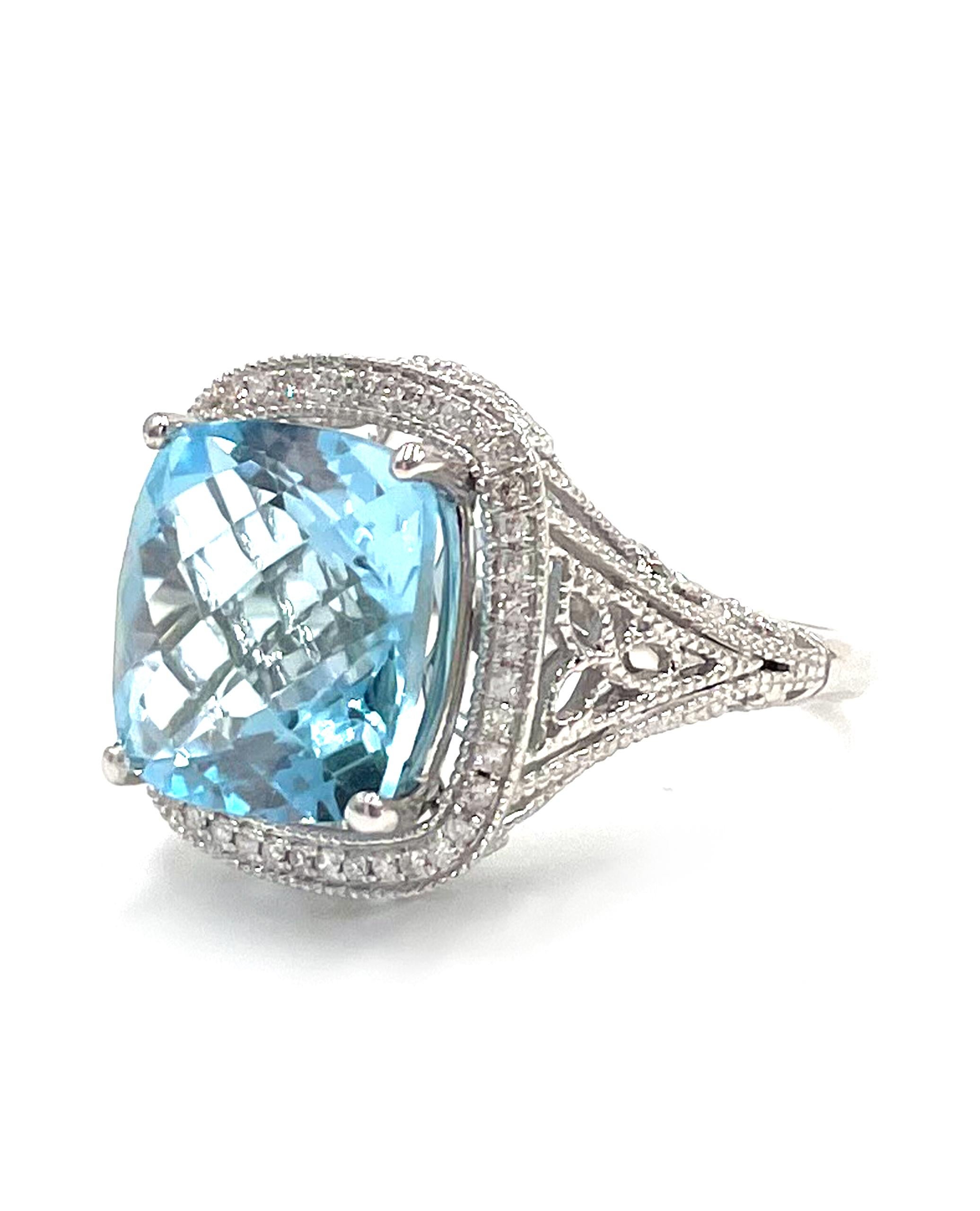14K white gold ring with modern filigree detail.  The ring is furnished with 43 round brilliant-cut diamonds with a total weight of 0.24 carat. In the center is one chequered cut blue topaz weighing 10.20 carats.

* Diamonds are H/I color, SI