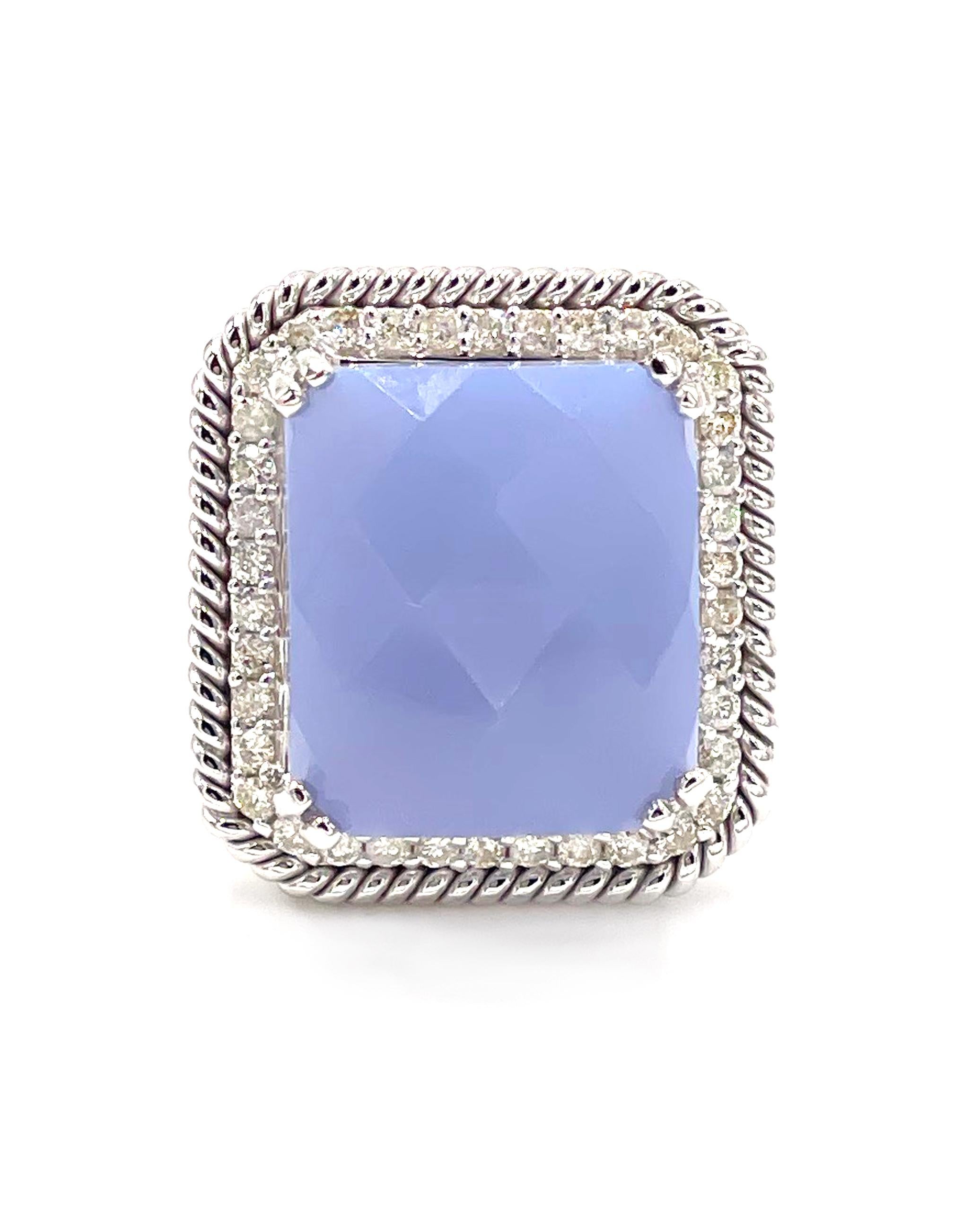 14K white gold ring with 40 round faceted diamonds 0.56 carats and one center rectangular faceted chalcedony 15.4x13.4mm.

* Finger size 6.5