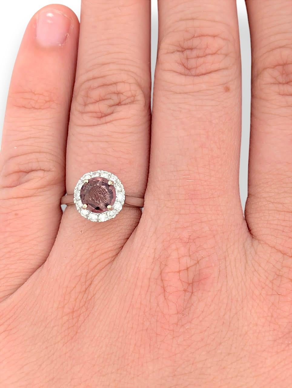 The Sienna ring is a striking blend of color and brilliance, featuring a 1.00ct natural tourmaline set in polished 14K white gold. Encircling the center stone is a 0.33ctw halo of natural diamonds—elevating the design with radiant sparkle.

Metal: