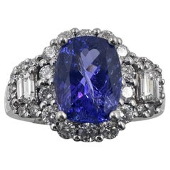 Bague en or blanc 14K avec 1.50Ct. Tanzanite et diamants 1.00 Ct. (Taille 6.00)