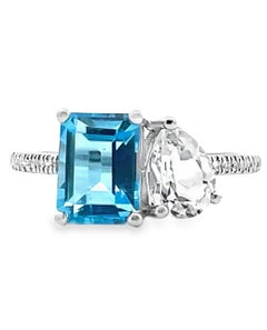 Anillo de oro blanco de 14 quilates con topacio azul de 2,05 quilates y topacio blanco con diamantes