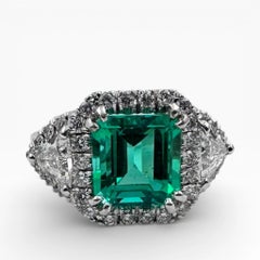 14K White Gold Ring with 4.46 Ct. Emerald and Diamonds. (Size 8.25)