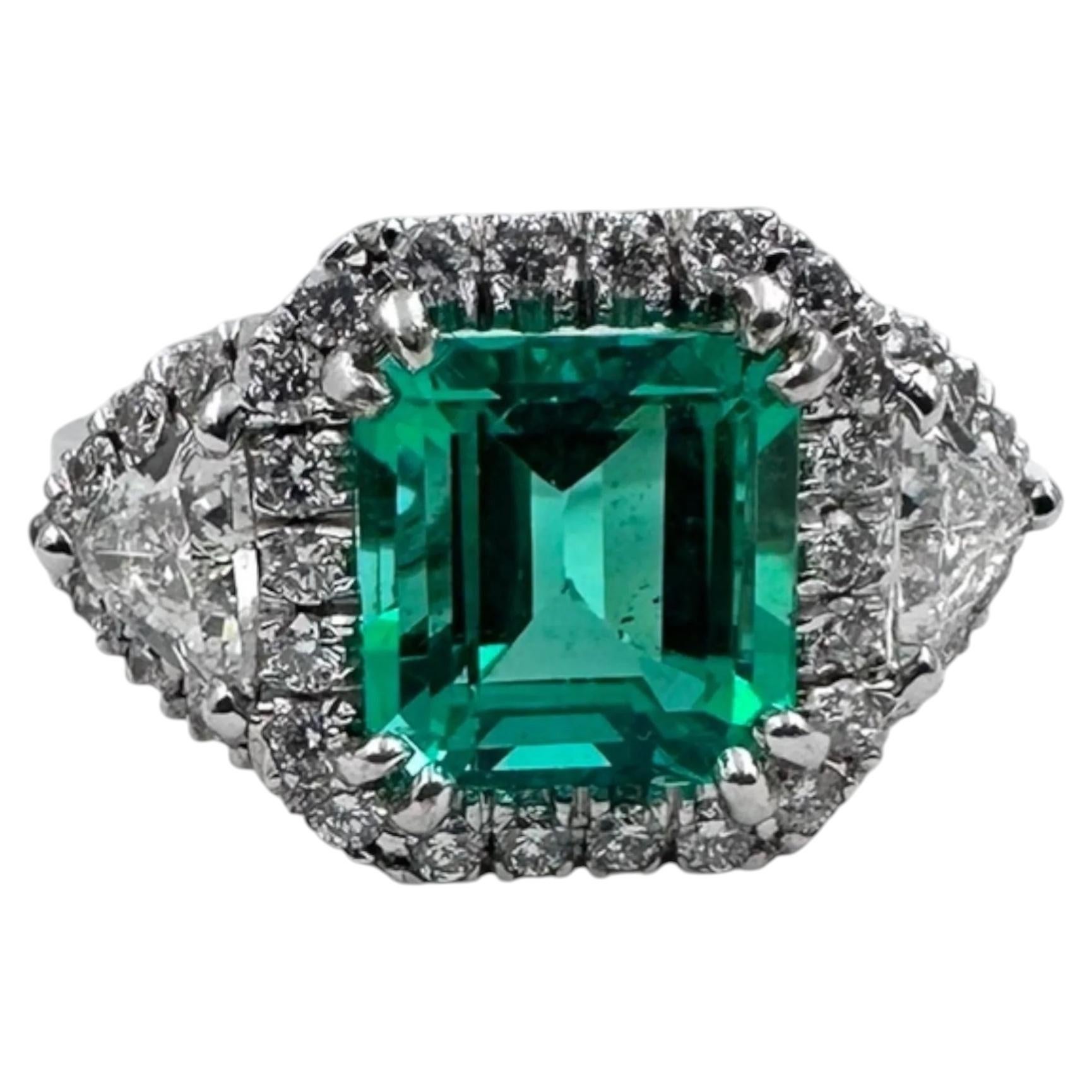 14K White Gold Ring with 4.46 Ct. Emerald and Diamonds. (Size 8.25)