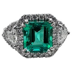 14K White Gold Ring with 4.46 Ct. Emerald and Diamonds. (Size 8.25)
