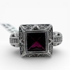 14K White Gold Ring with Garnet and Diamonds. (Size 7.75)