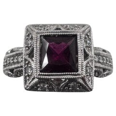 14K White Gold Ring with Garnet and Diamonds. (Size 7.75)