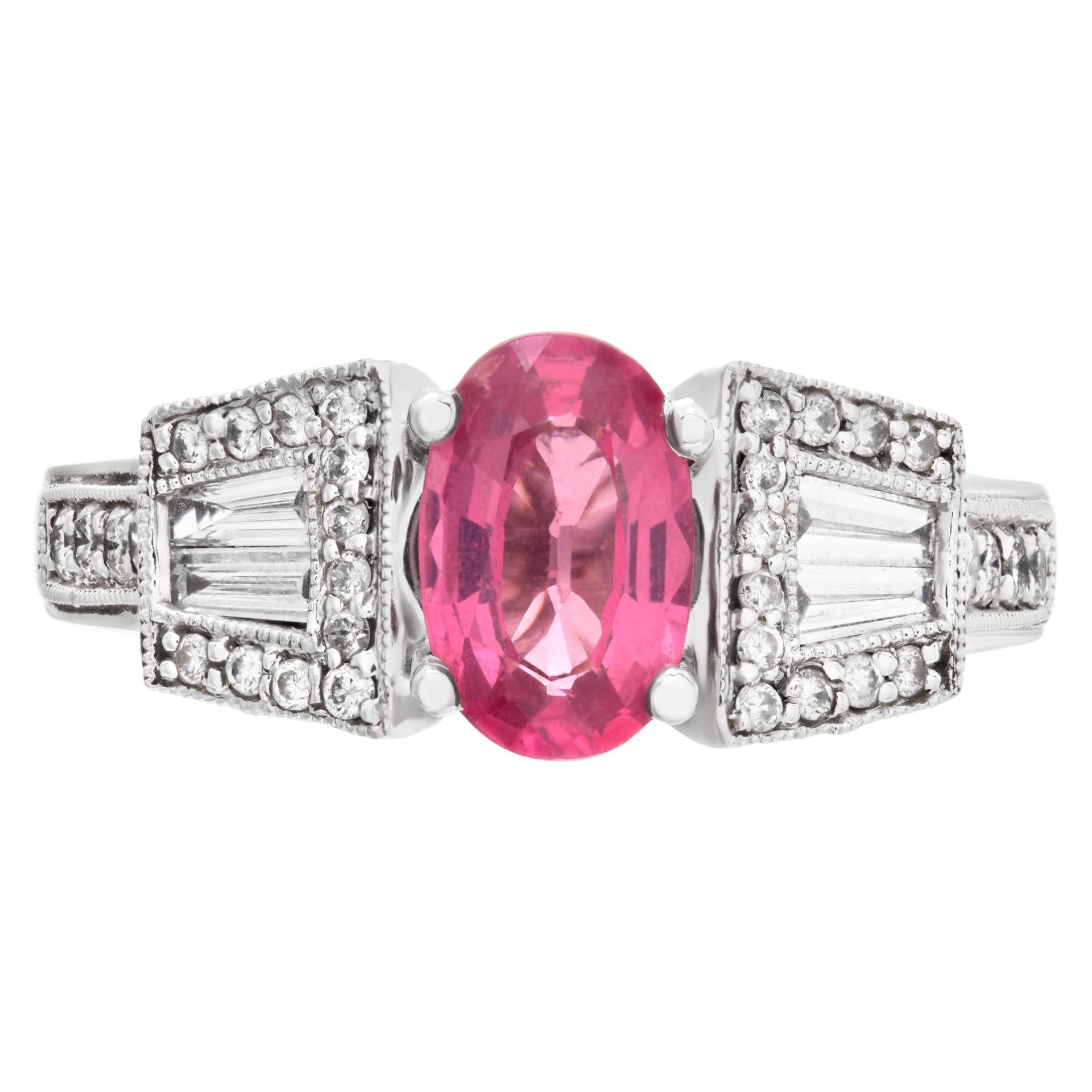 Pretty in Pink! Oval brilliant cut pink Spinel (approx. 2 carats) & diamonds ring set in 14k white gold. Round brilliant and baguette cut diamonds total approx. weight: 1.28 carat, estimate: G-H color, VS clarity. 8mm h x 20mm wide.Size 6.This