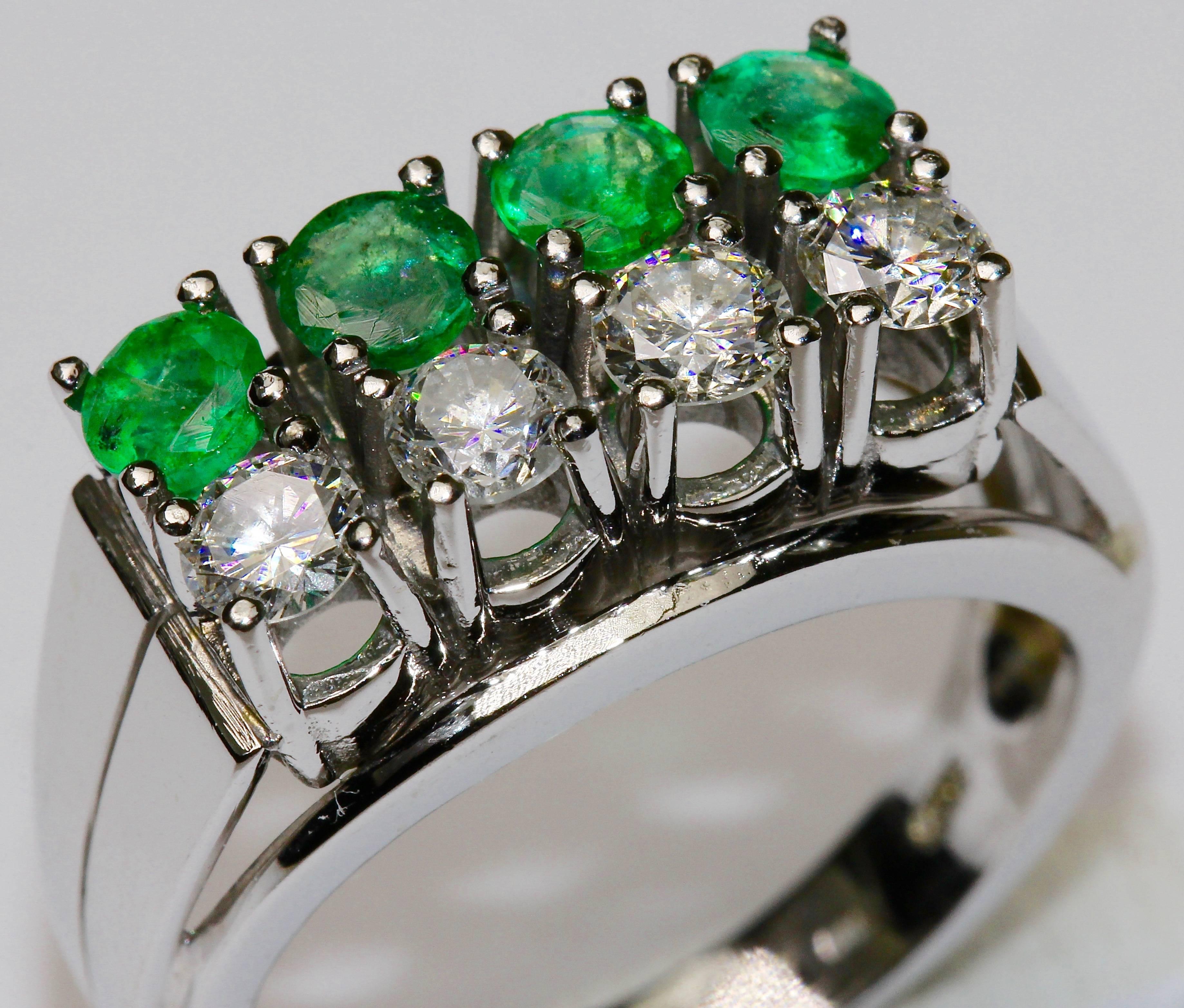 Charming ladies white gold ring, set with four round diamonds and four emeralds.
Diamonds: Approx. 0.18 ct. each, fine white, VSI to Si
Emeralds each about 0.2 to 0.23 ct.

Hallmarked.