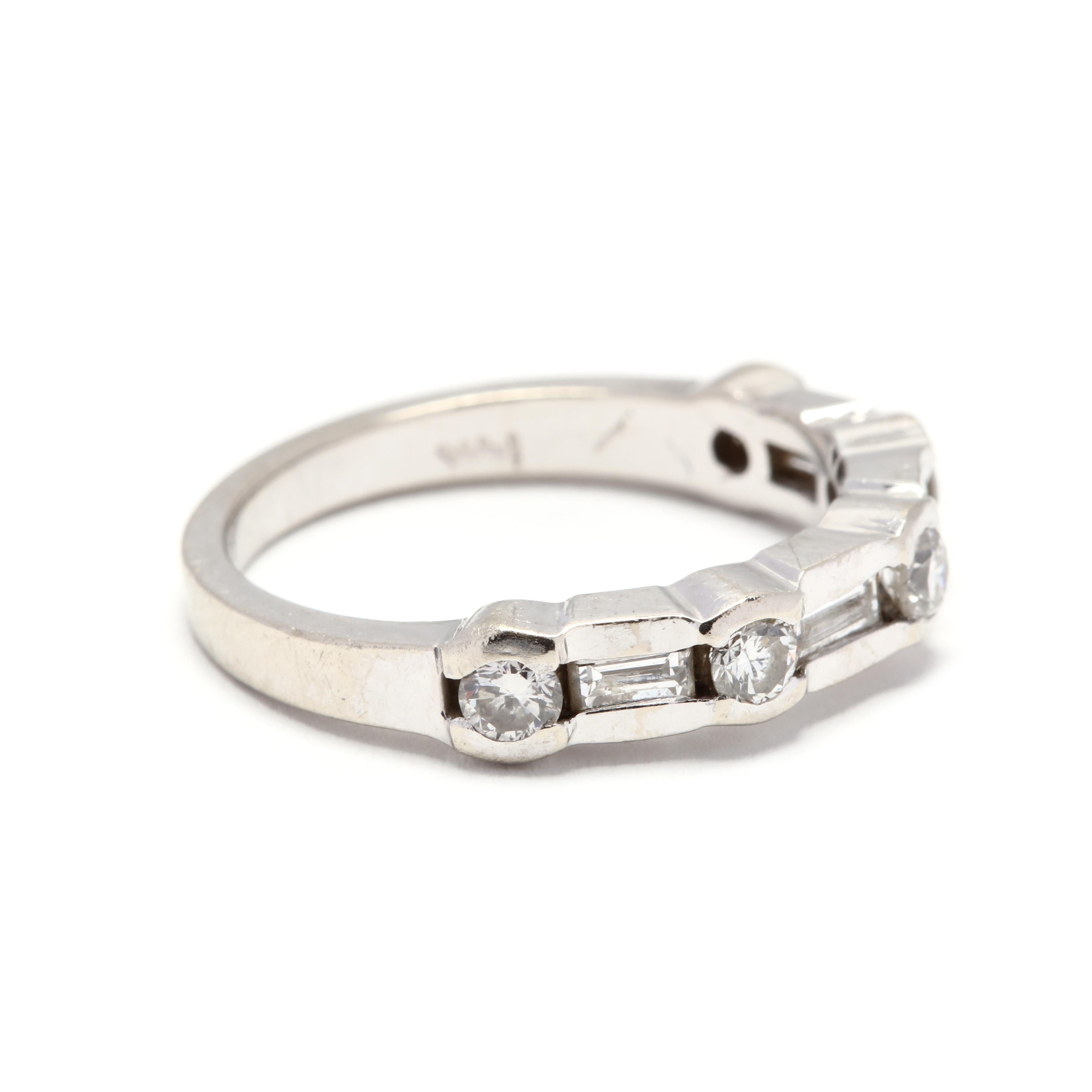 A 14 karat white gold round and baguette cut diamond stackable band ring. This ring features alternating, channel set round brilliant cut diamonds weighing approximately .55 total carats and baguette cut diamonds weighing approximately .44 total