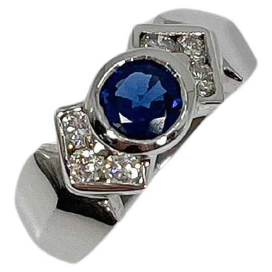 14K White Gold Round Bezel .60 CT Sapphire and .50 CTW Diamond Ring For Sale