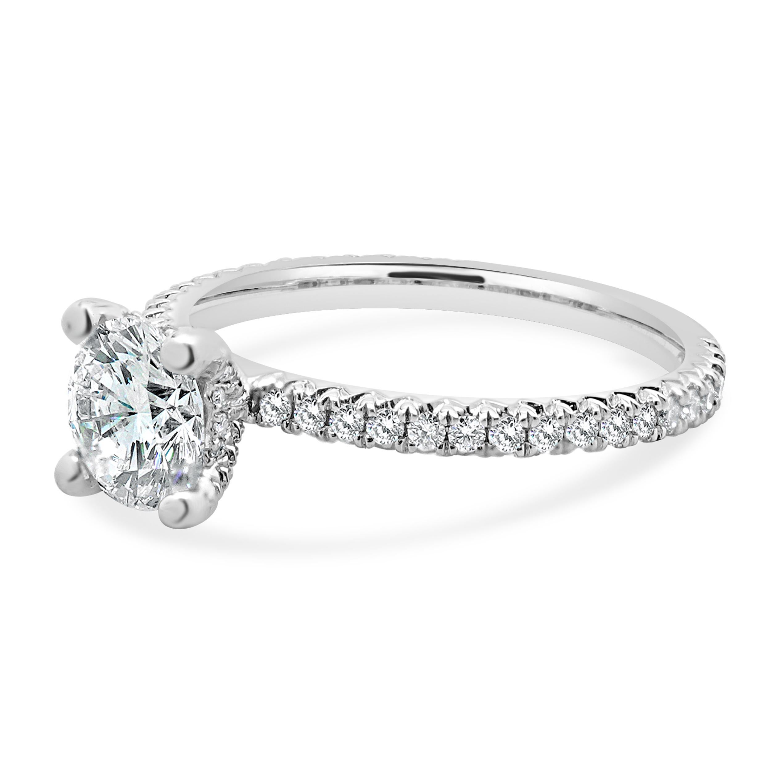 Designer: custom
Material: 14K White Gold
Diamond: 1 round brilliant cut = 1.02ct
Color: H
Clarity: VS2
Diamond:  round brilliant = 0.45cttw
Color: G
Clarity: SI1
Ring Size: 6.5 (complimentary sizing available)
Weight: 2.45 grams

