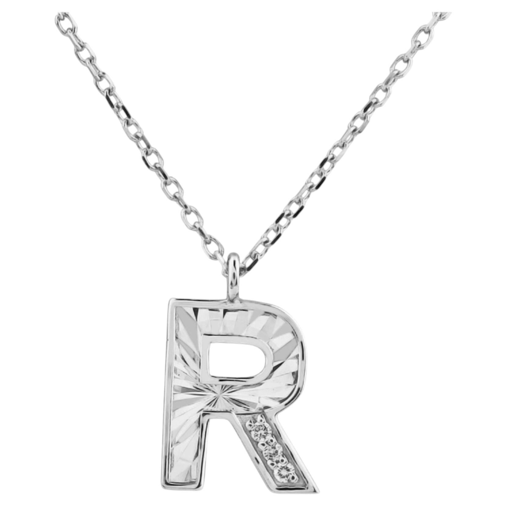 Collier avec pendentif en or blanc 14 carats orné d'une initiale « R » sertie d'un diamant taille ronde