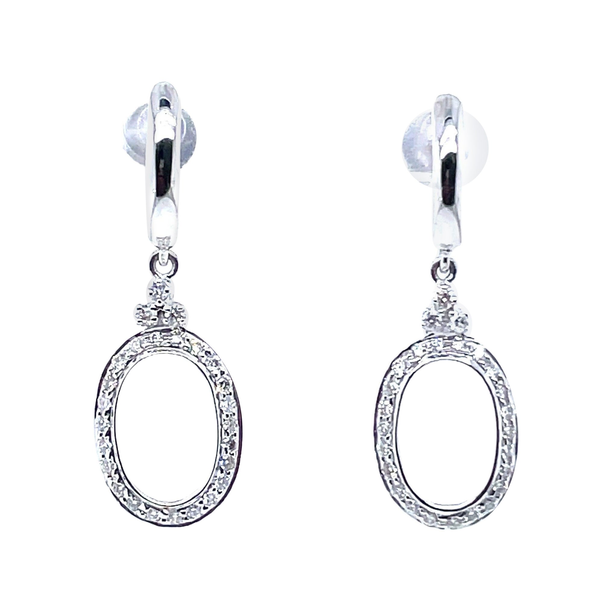 Orecchini pendenti ovali con diamante rotondo in oro bianco 14k