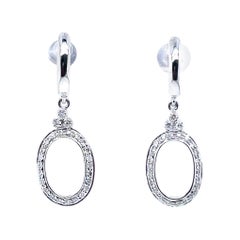 Orecchini pendenti ovali con diamante rotondo in oro bianco 14k
