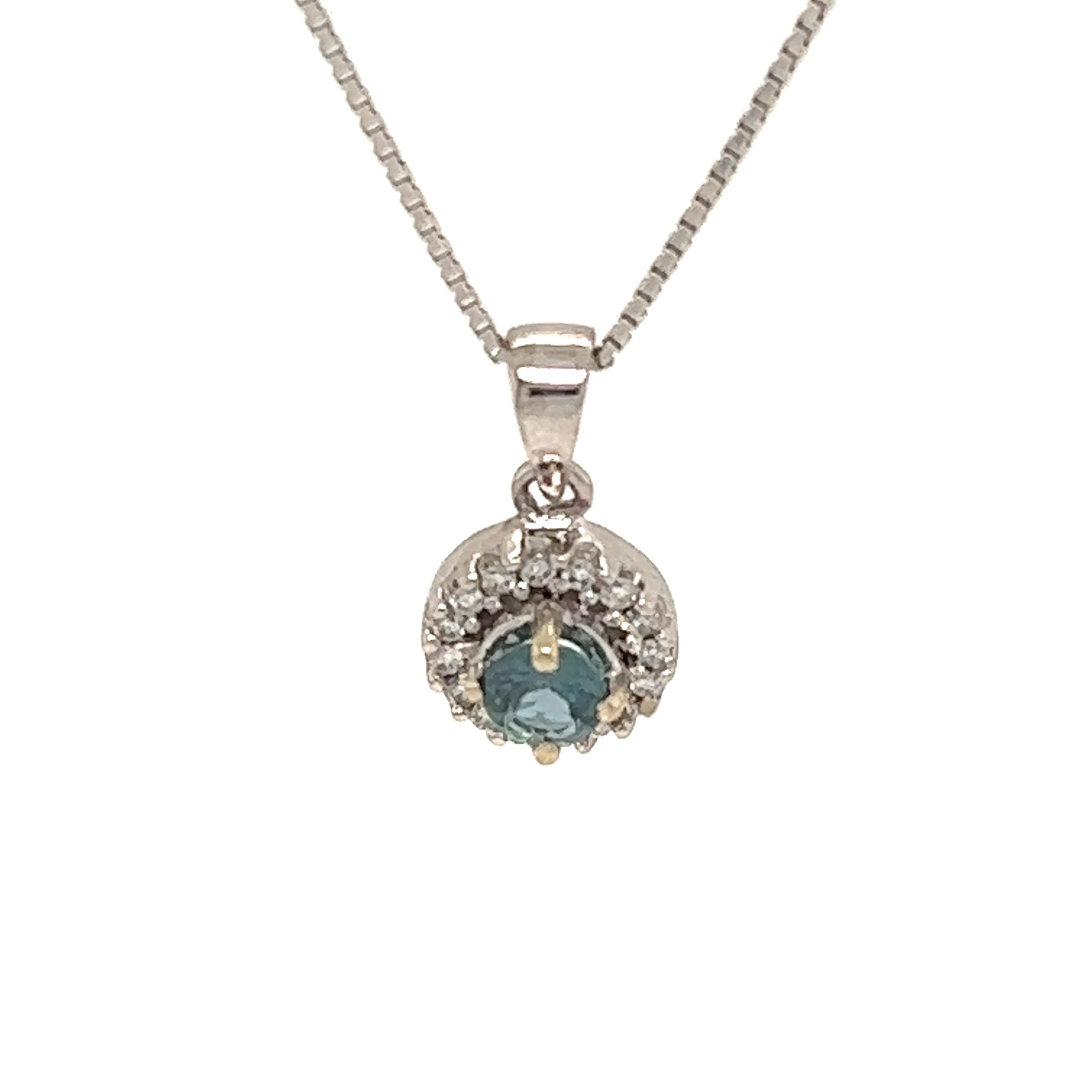 This is an exceptional natural round-shaped alexandrite and diamond pendant set in solid 14K white gold. The fancy 4.3MM Alexandrite has an excellent green color and is surrounded by a halo of round-cut white diamonds. The pendant is stamped 14K and