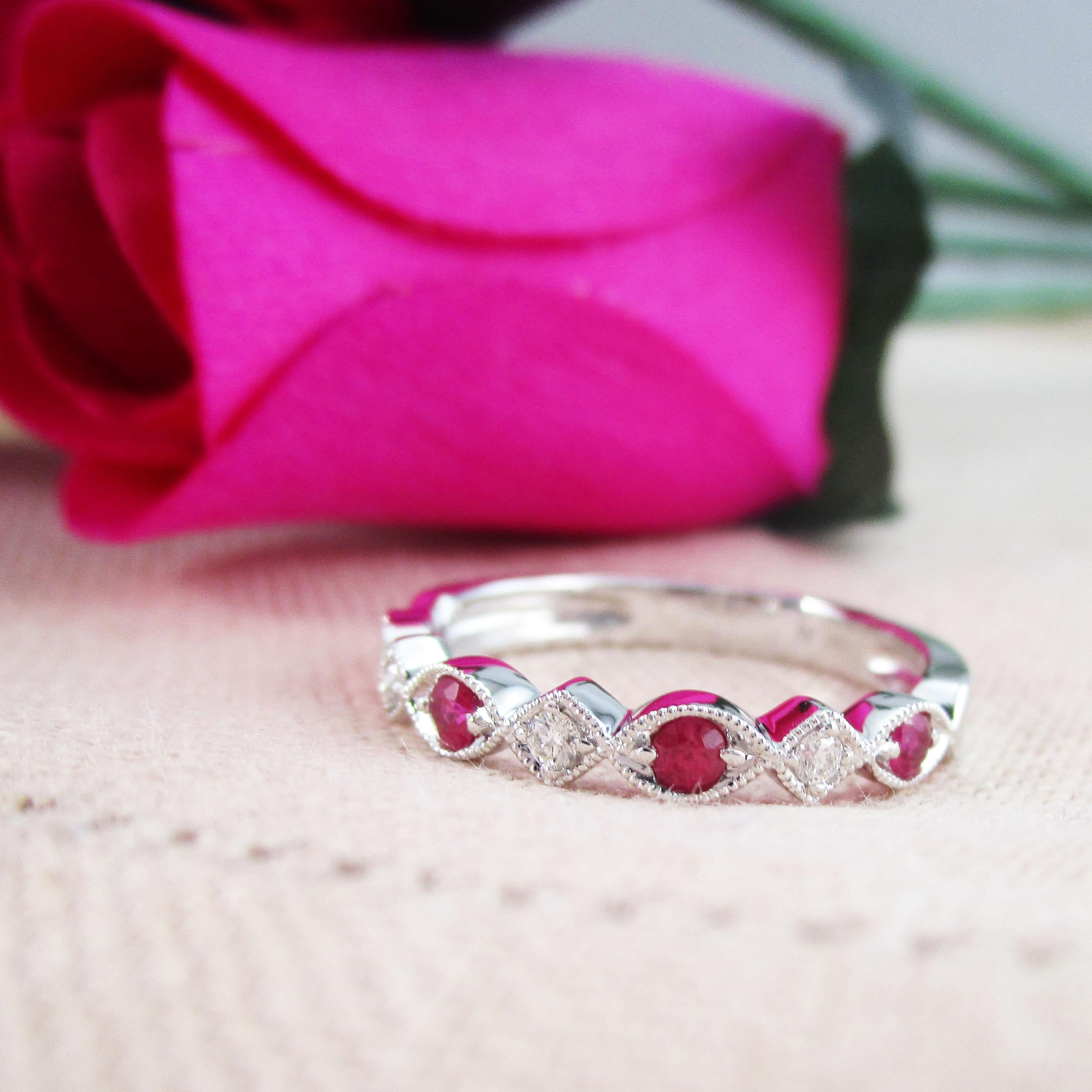 This is a gorgeous half band in 14k white gold with a beautiful selection of bright red rubies and brilliant white diamonds! The stones are set in an alternating pattern, with a total of four rubies and three diamonds. The stones are surrounded by