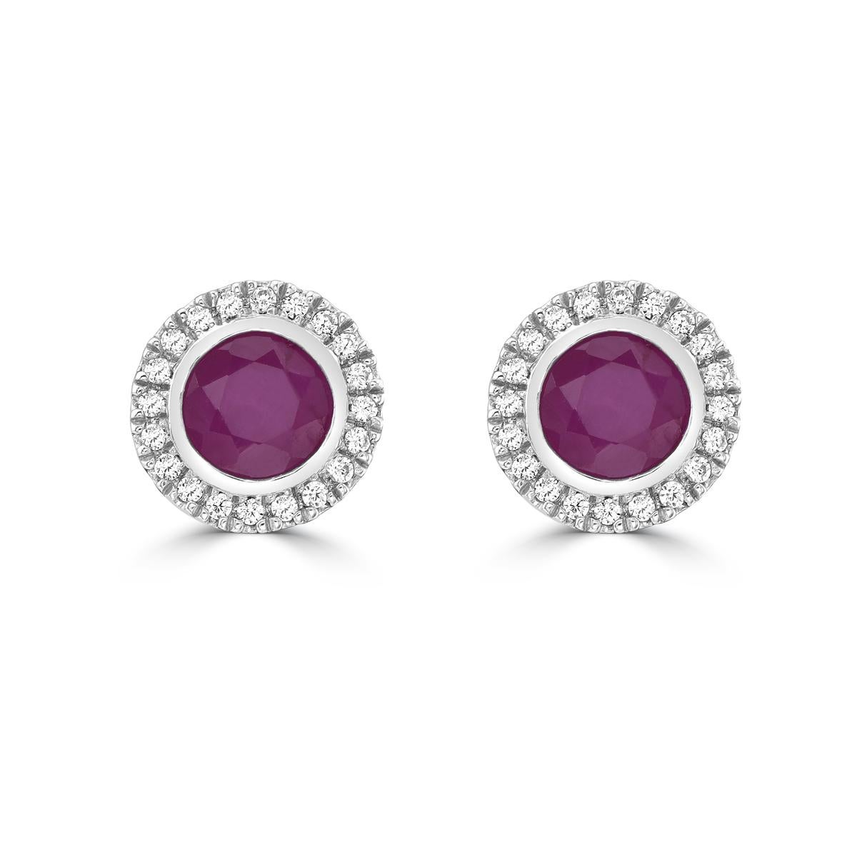 Indulge in luxury with our Ruby and Diamond Halo Stud Earrings in 14K White Gold. Featuring stunning round rubies, these ruby stud earrings exude sophistication and exclusivity. The dazzling halo design with accompanying diamonds adds an elegant