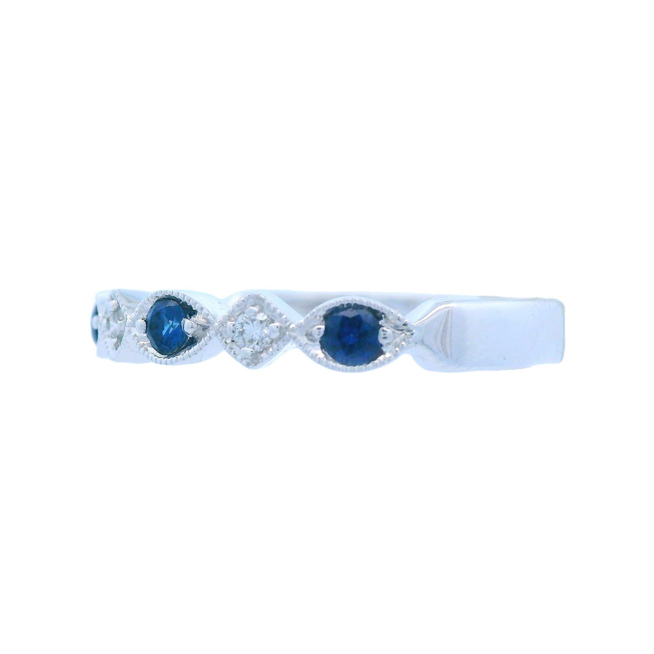 This lovely band by Allison Kaufman is made in 14k white gold with blue sapphires and sparkly white diamonds. Allison Kaufman has been around since the 1920s, and is one of the most respected and sought after jewelry manufacturers in the United