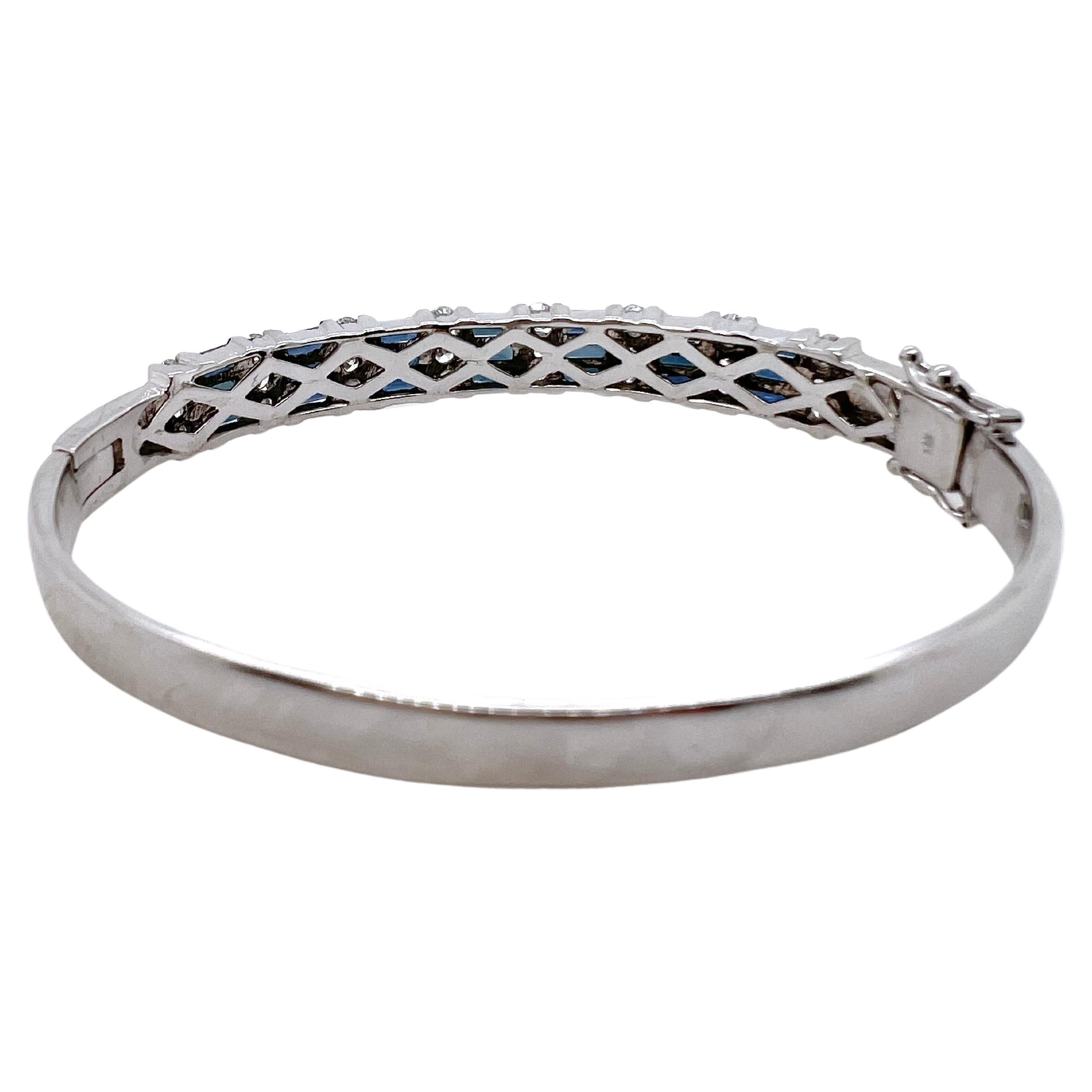 This iconic bangle is made in 14k white gold and has sapphire baguettes channeled set along with round diamonds channeled set.  Each section has 3 sapphire baguettes followed by 3 diamonds which makes it symmetrical.  It is perfect for smart casual