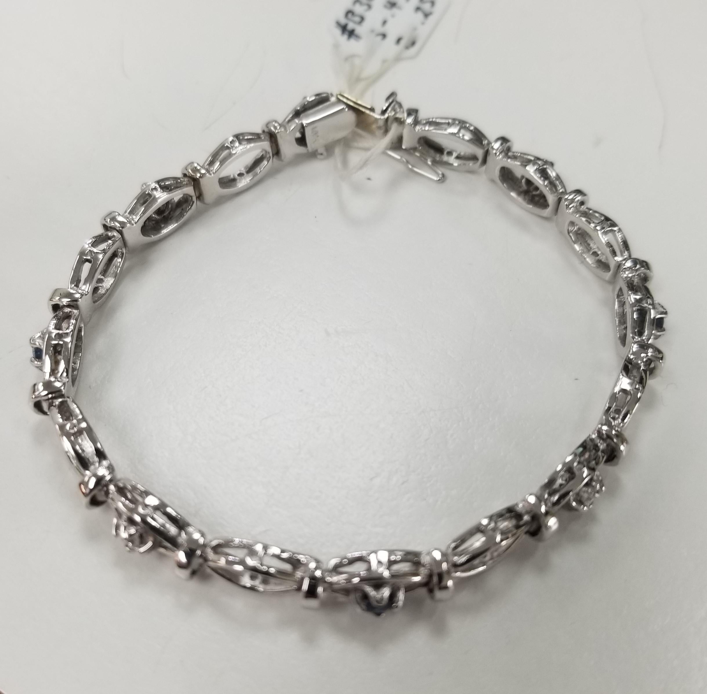 14k white gold sapphire and diamond bracelet, containing 4 round sapphires of gem quality weighing .43pts. and 4 round full cut diamonds; color 